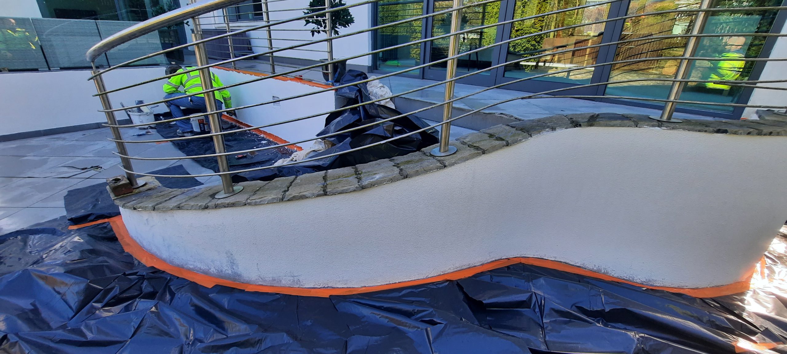 roughcast repair freshly finished with white coating