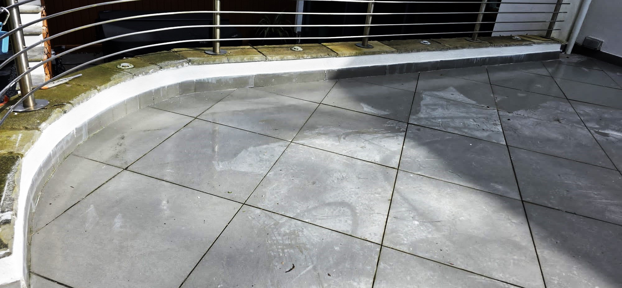 roughcasting Edinburgh on patio edge wall