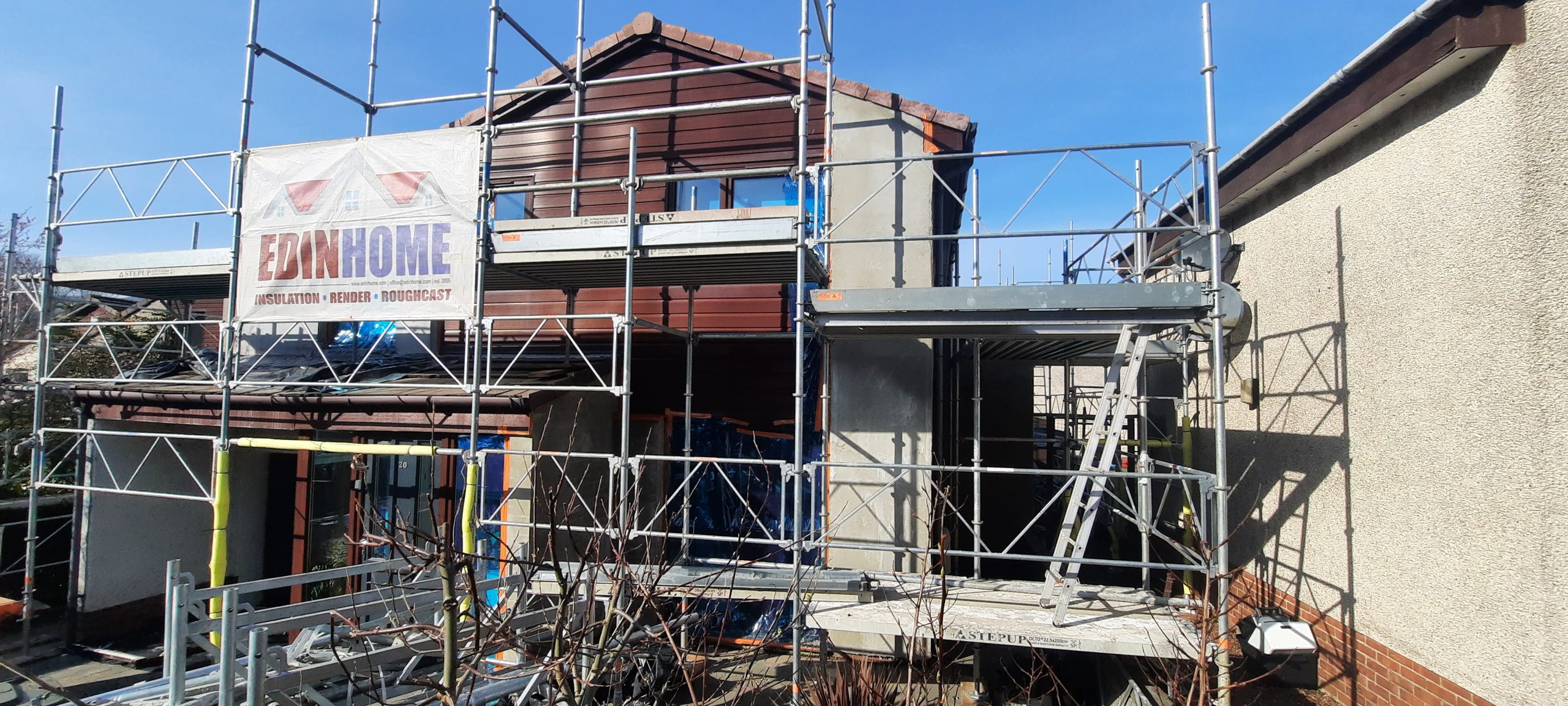 roughcasting Edinburgh on two-storey house with scaffolding