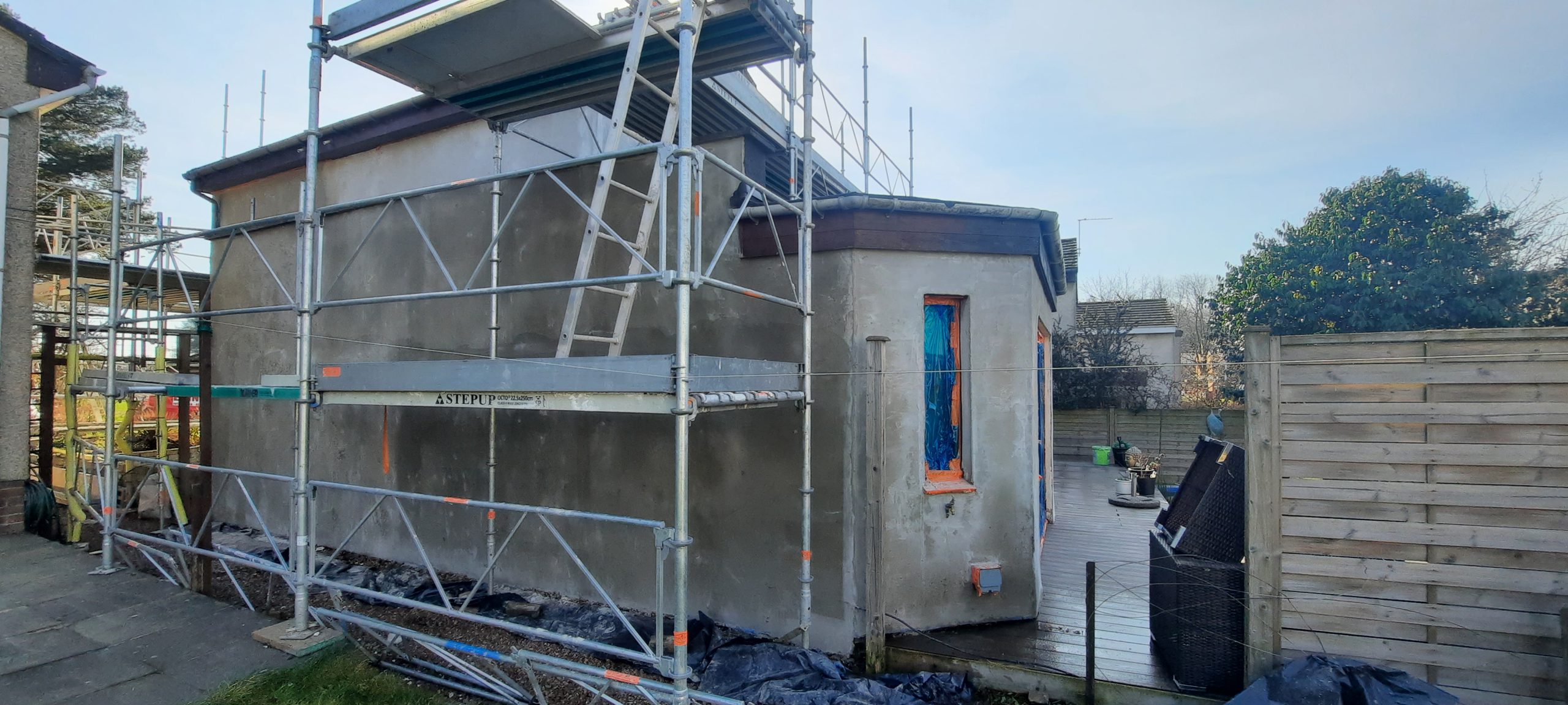 Insulation Edinburgh behind new roughcast layer