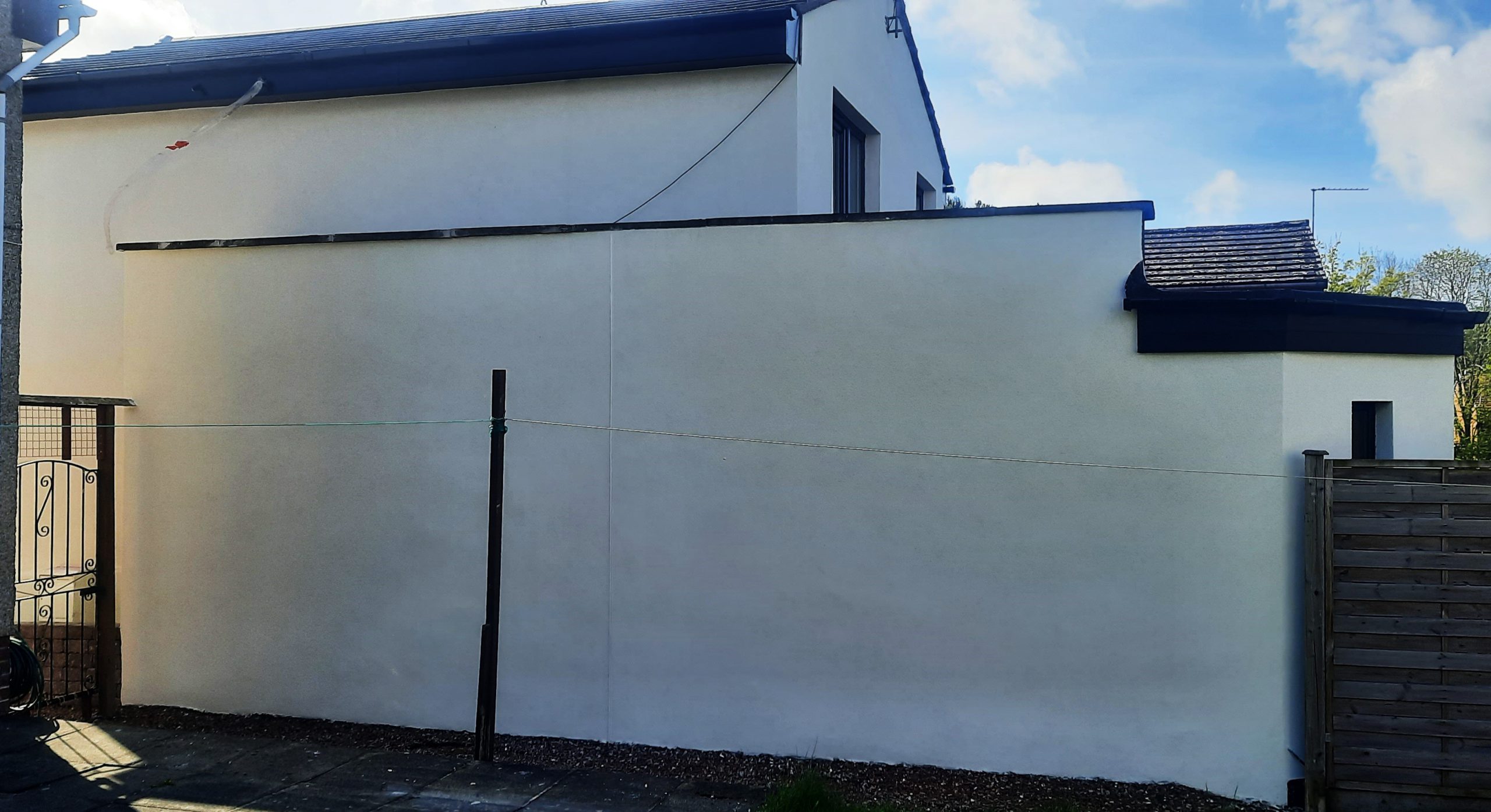 roughcast render repair on large smooth wall