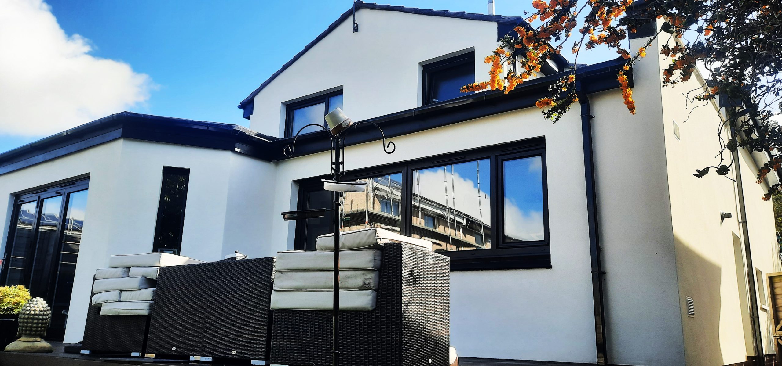 roughcaster Edinburgh completing black-trim window area
