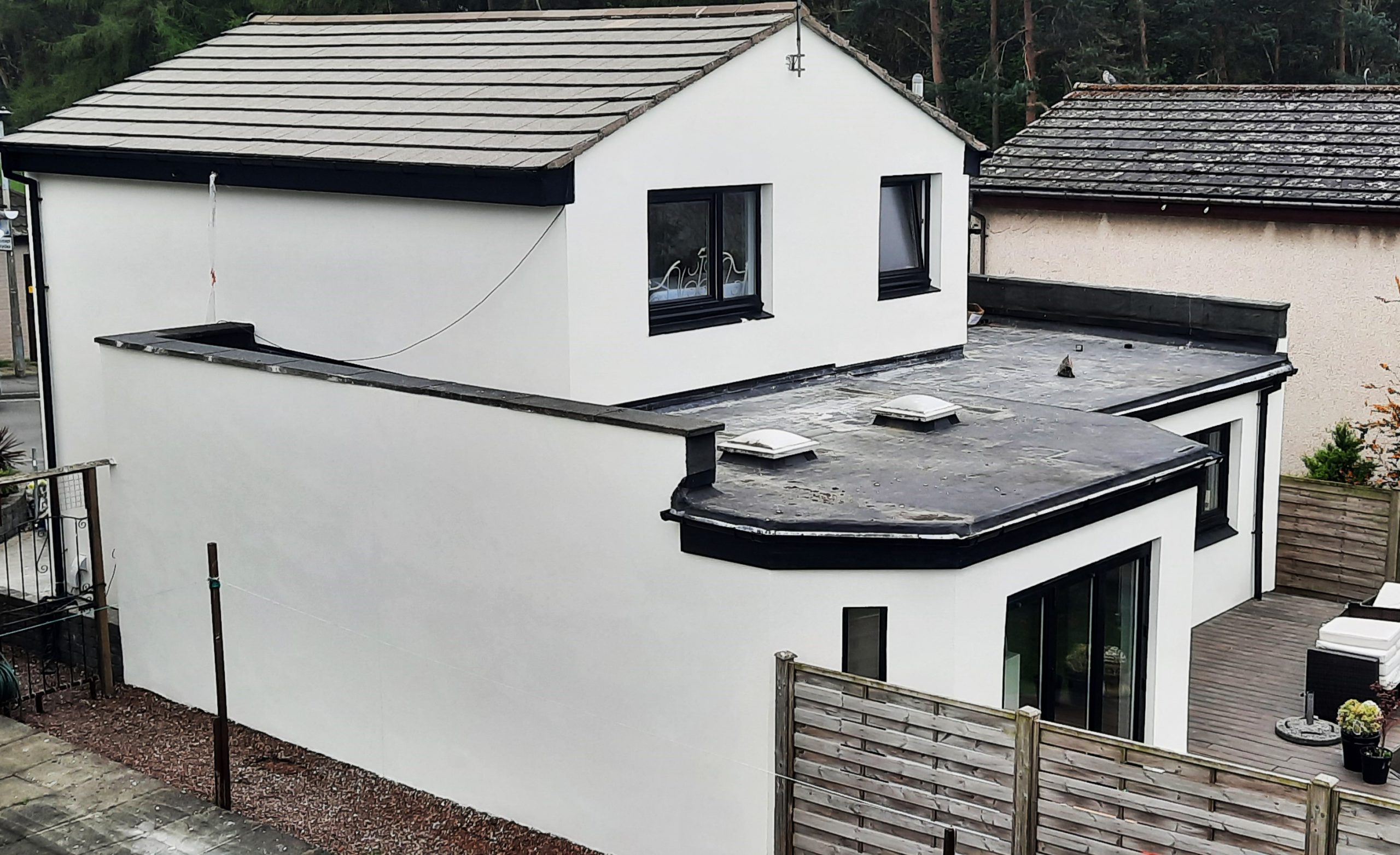roughcast render repair on upper gable wall