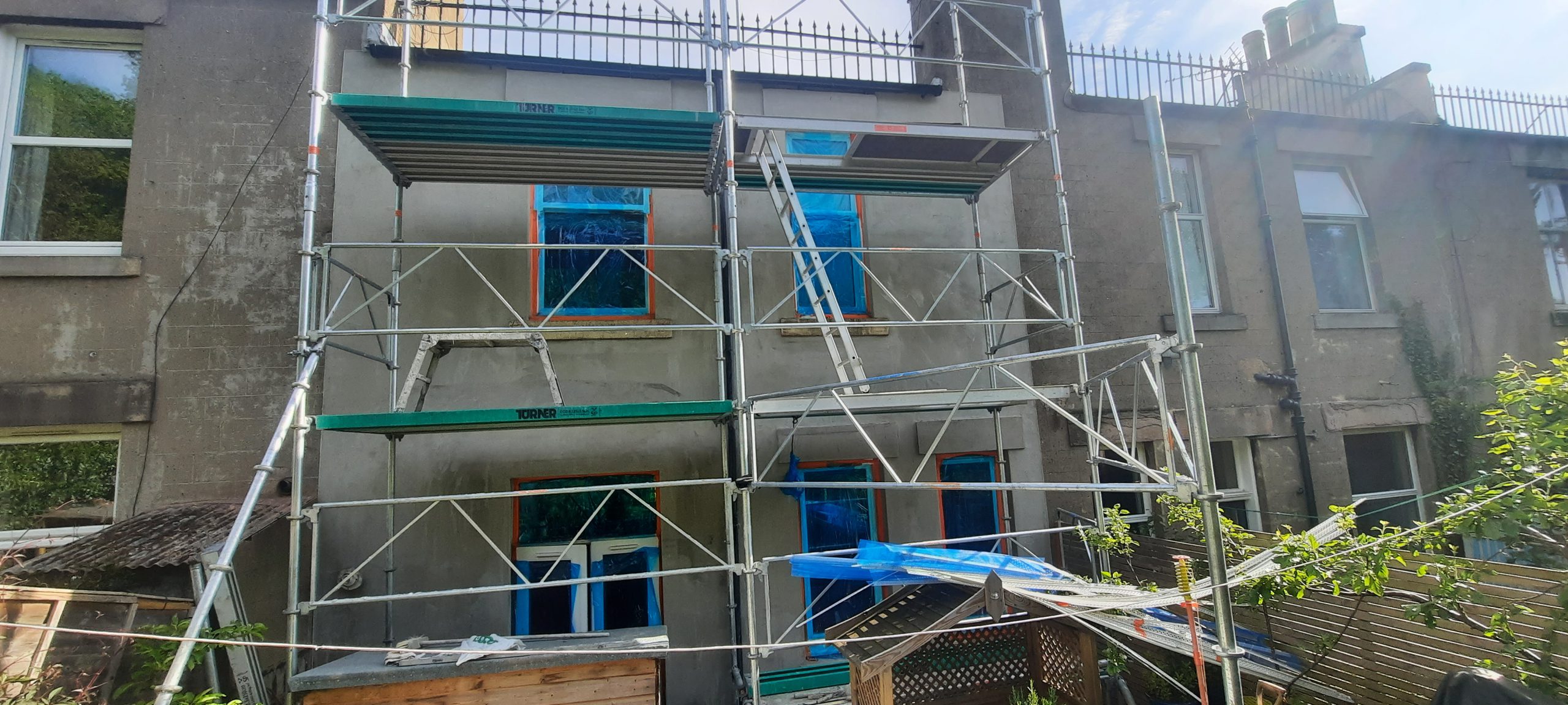 roughcast render repair with full scaffolding setup
