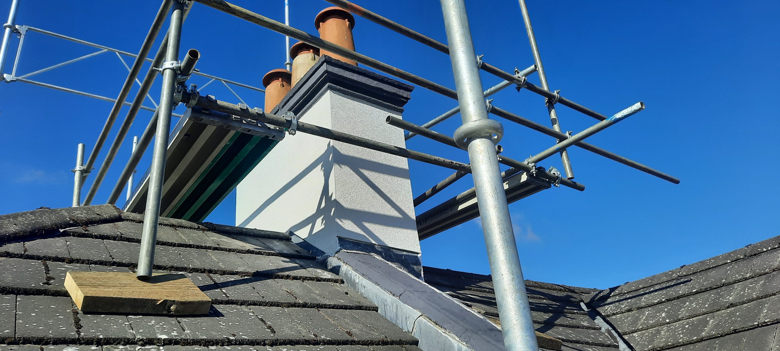 roughcast render repair around chimney area