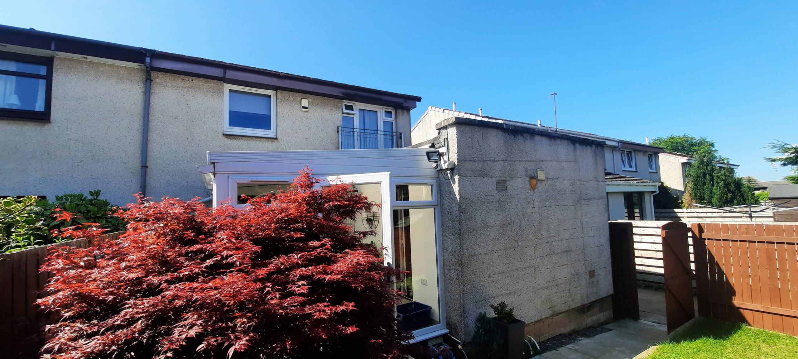 side wall of house with crisp, new roughcasting Edinburgh finish