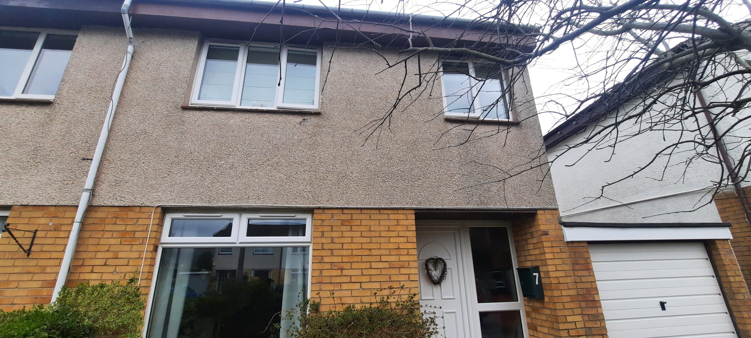 traditional facade featuring existing roughcast render for house rendering Edinburgh