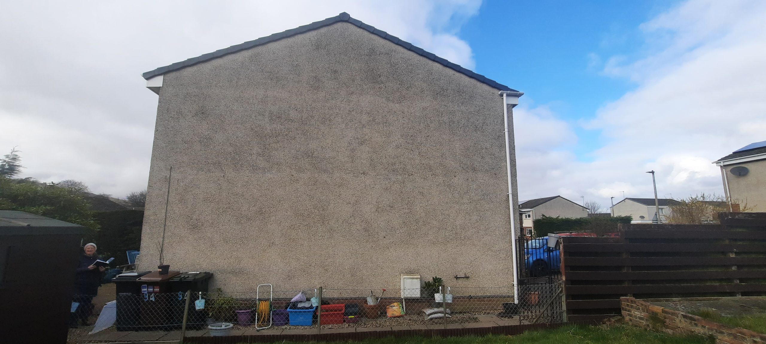 roughcast render repair on side house wall