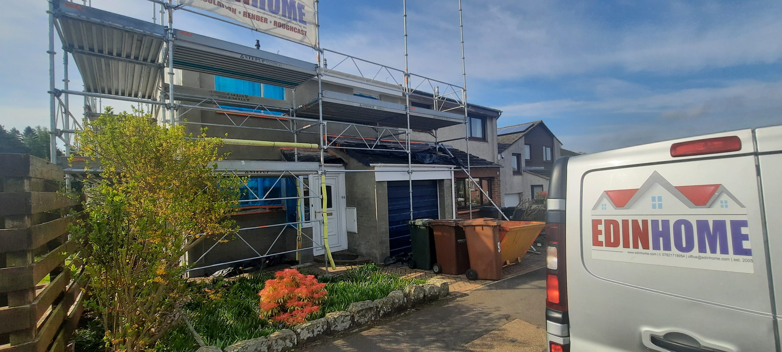 house exterior undergoing Insulation Edinburgh work with debris bins