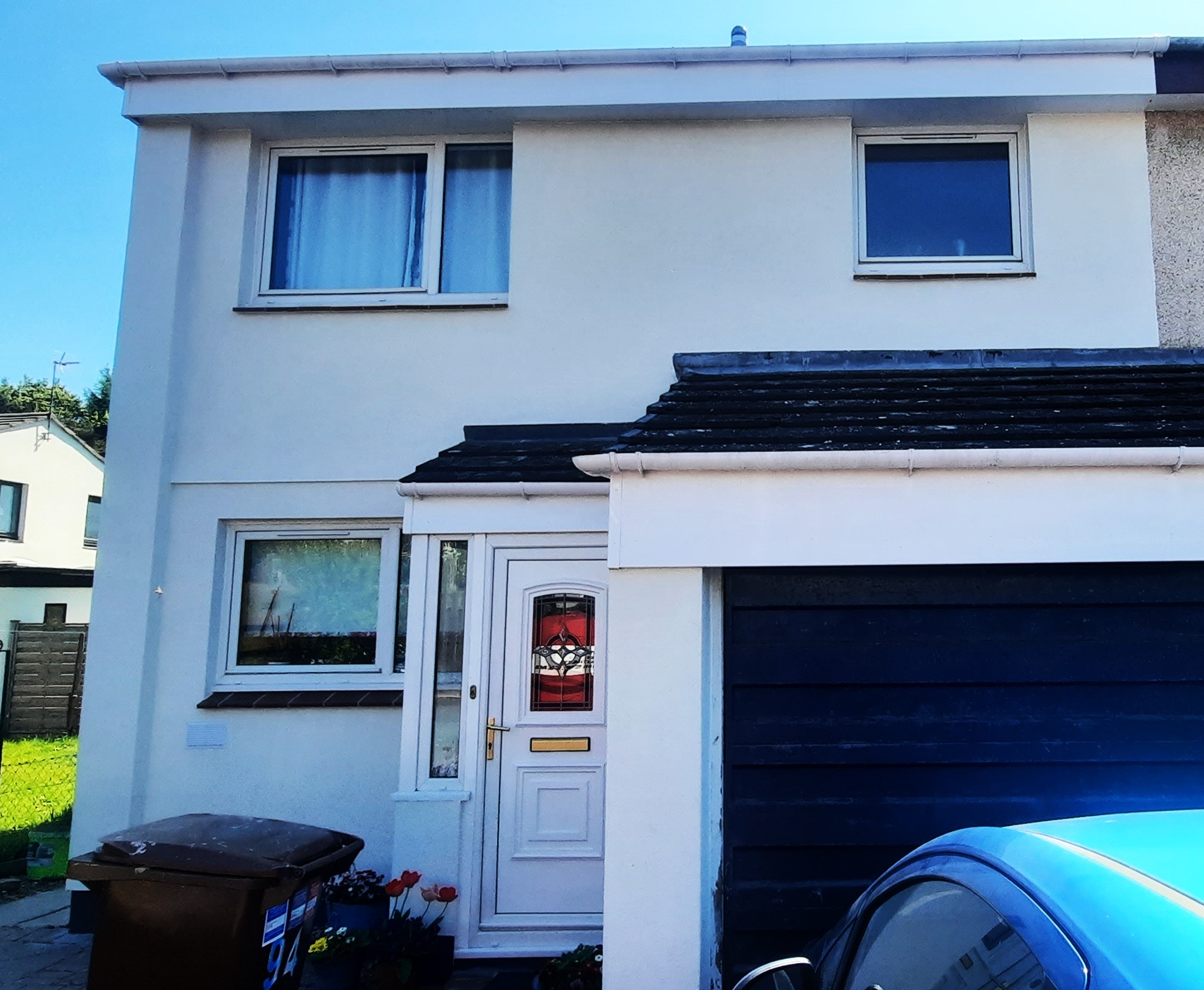 front of semi-detached home after roughcast render repair works