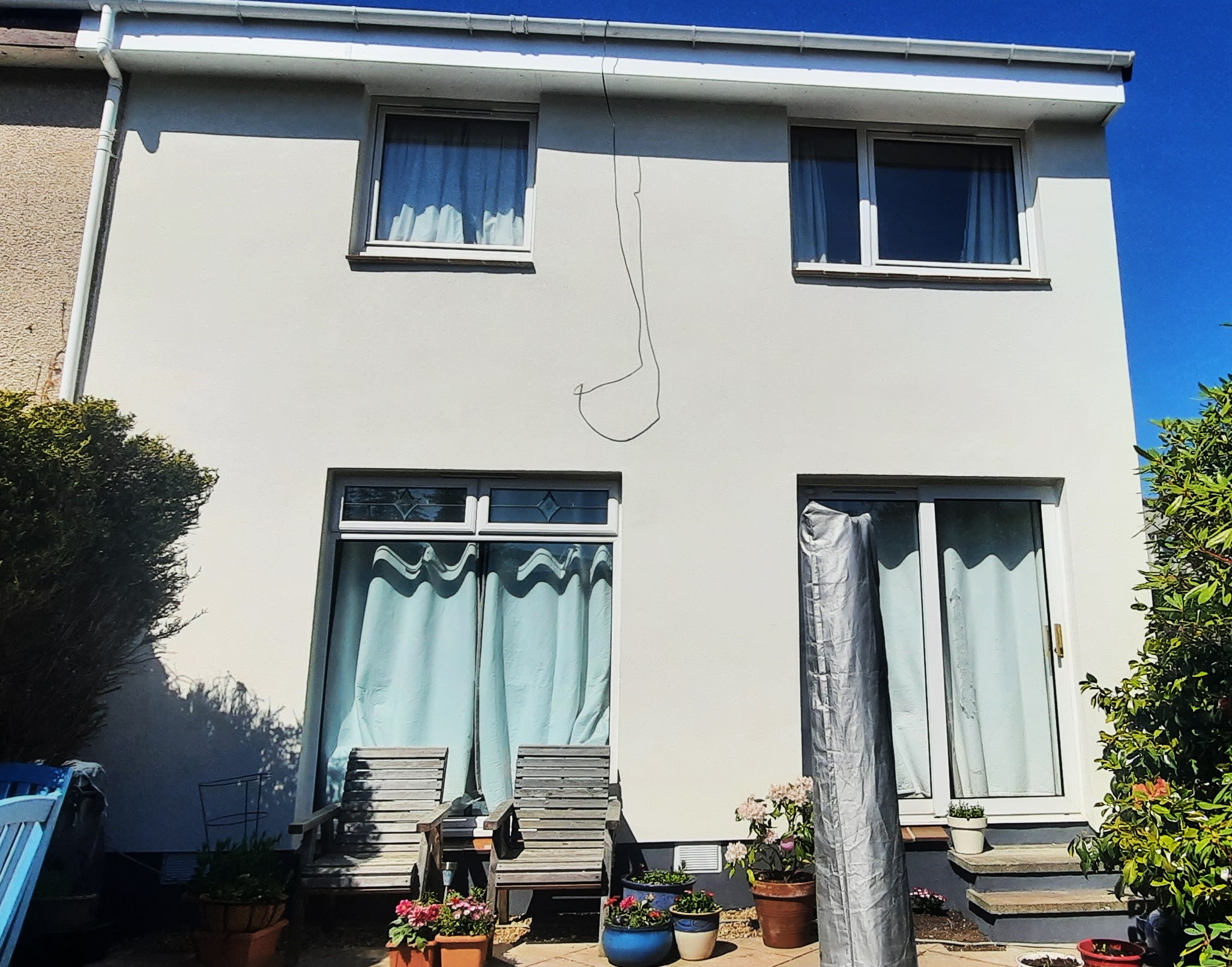 rear elevation of house with roughcast render Edinburgh and outdoor seating