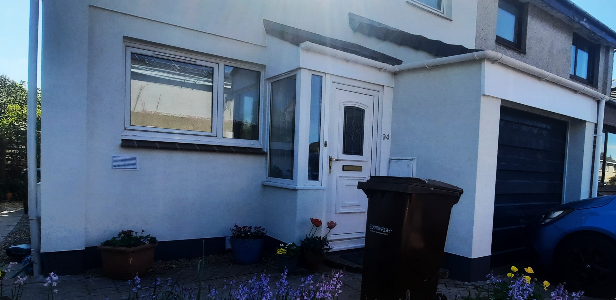 roughcast render repair for porch area with light blue accents