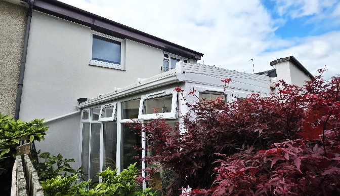 lighter patchwork showing fresh roughcast render Edinburgh finish