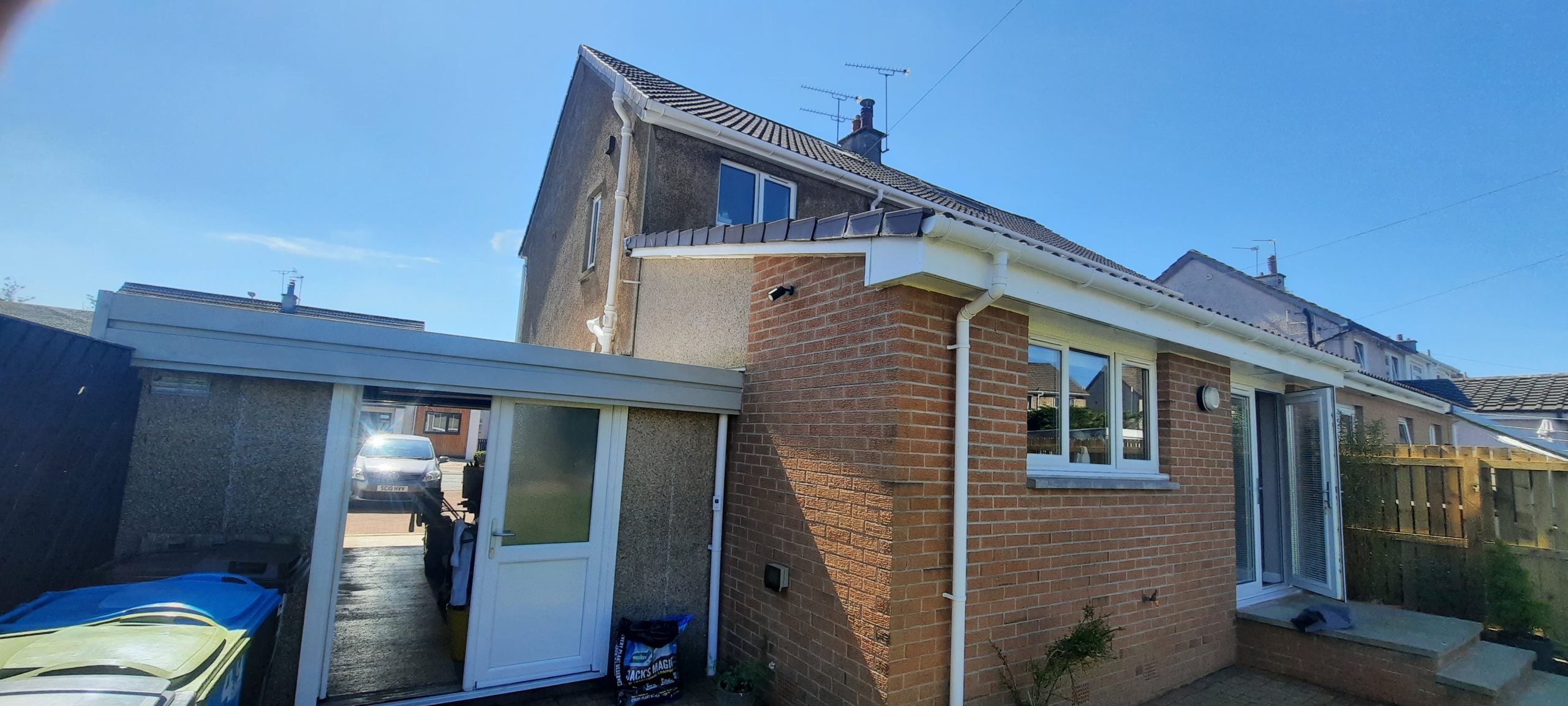 roughcast repair on front entrance wall of two-storey property