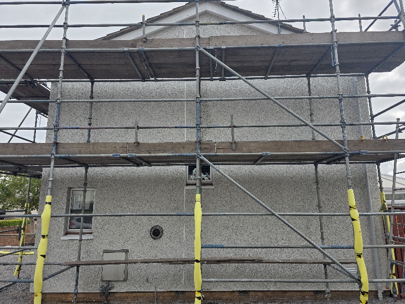 house rendering Edinburgh in progress with full scaffolding setup