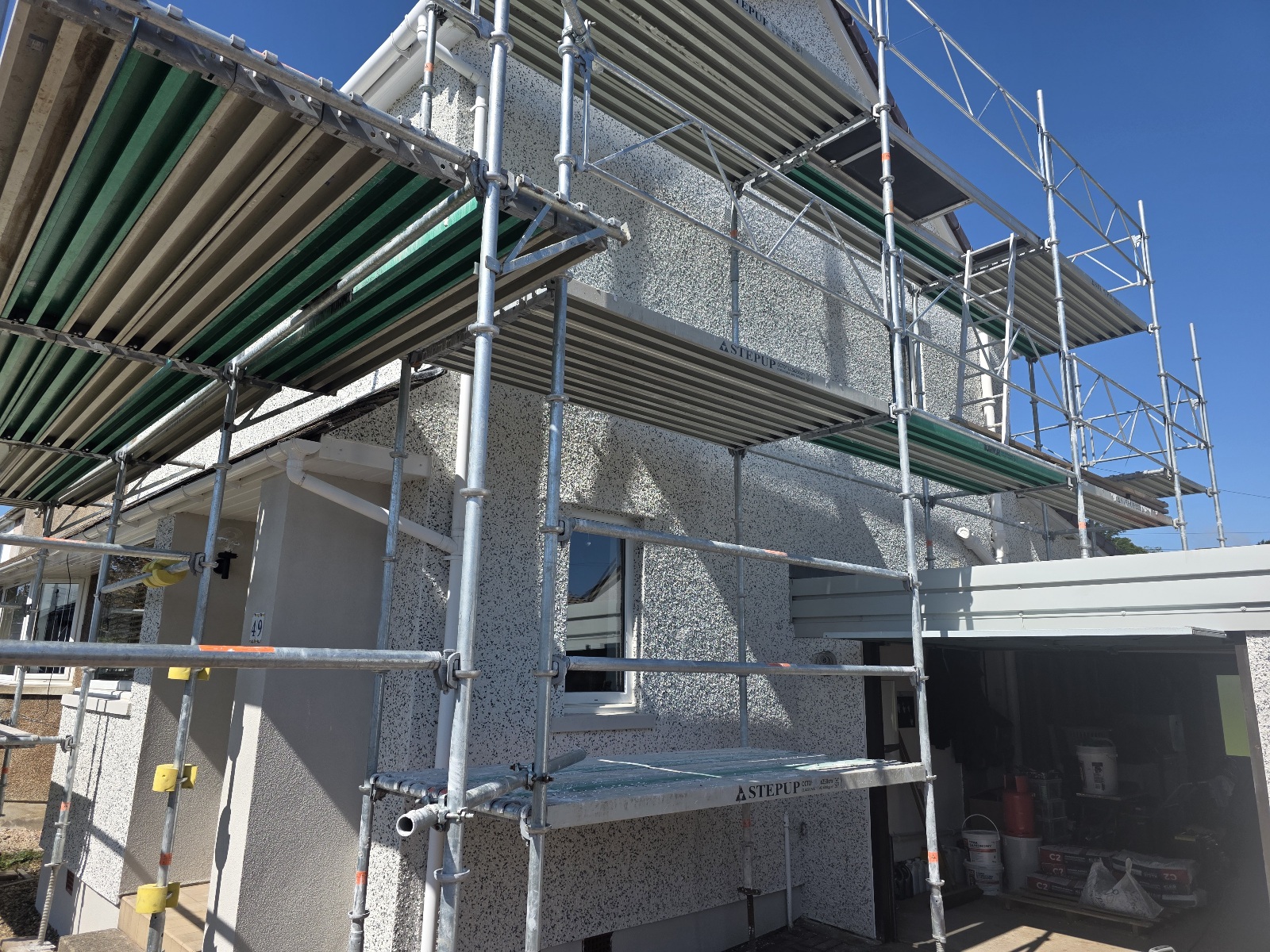 property under scaffolding for roughcast render Edinburgh application